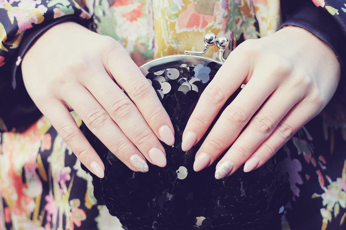 nude nails and sparkle black clutch