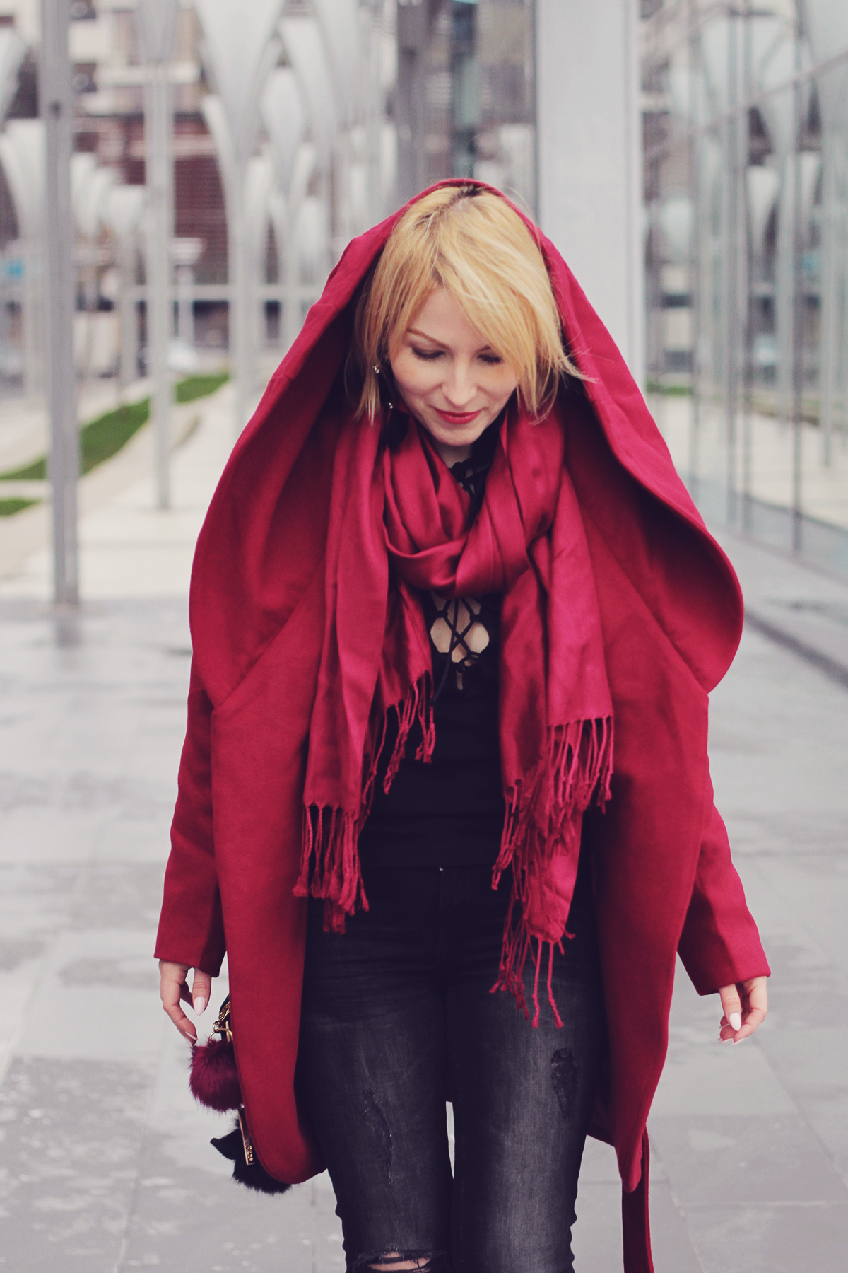 burgundy coat and scarf with cut-out jeans
