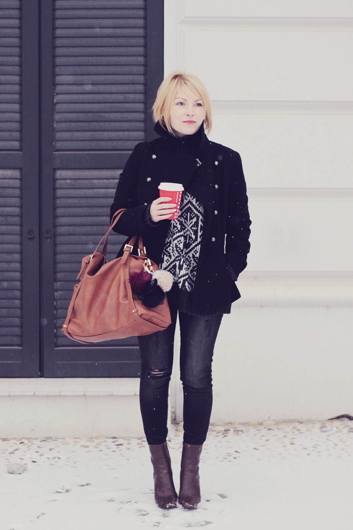 first snow-large tote bag black coat and jeans