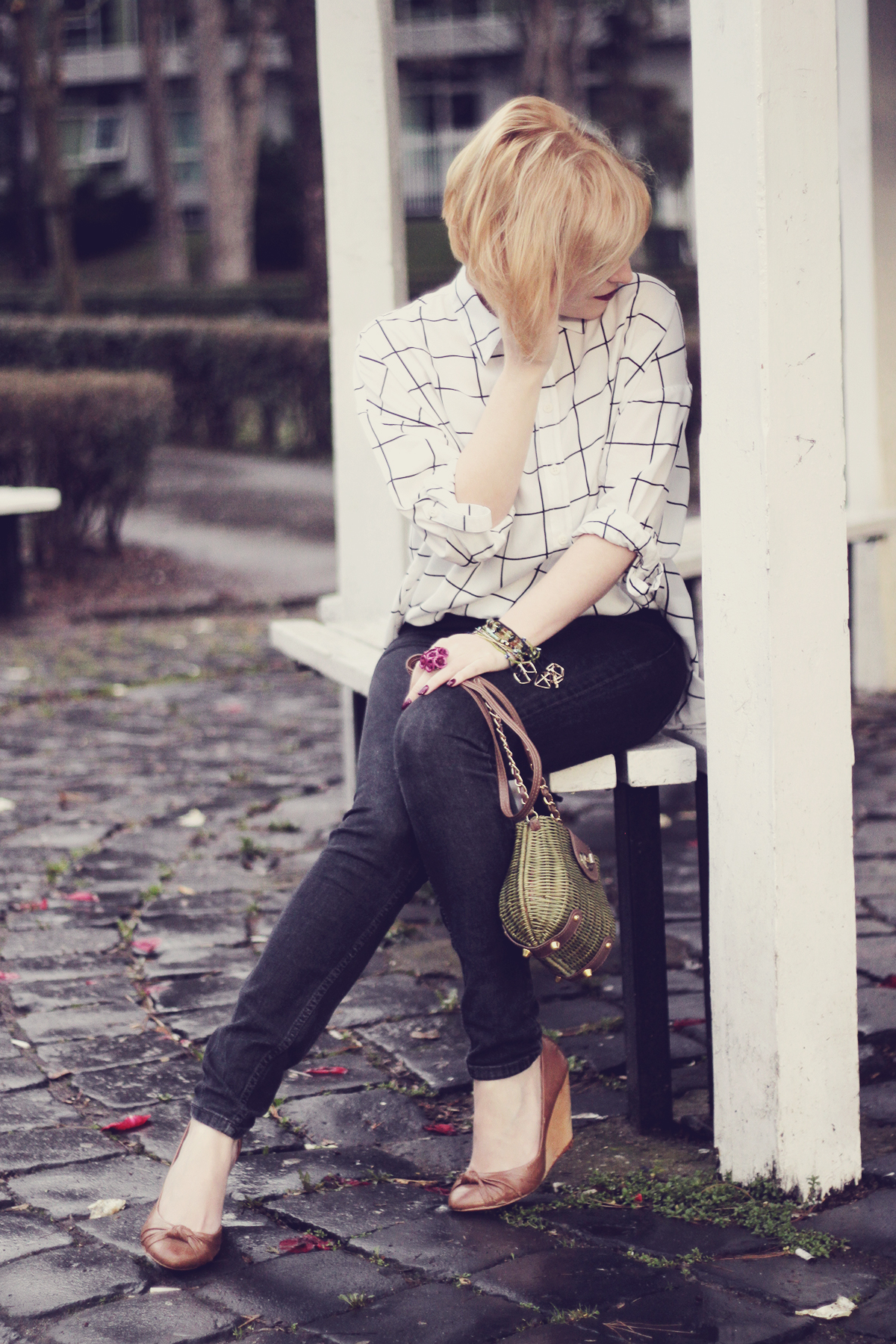 black and white shirt and green purse