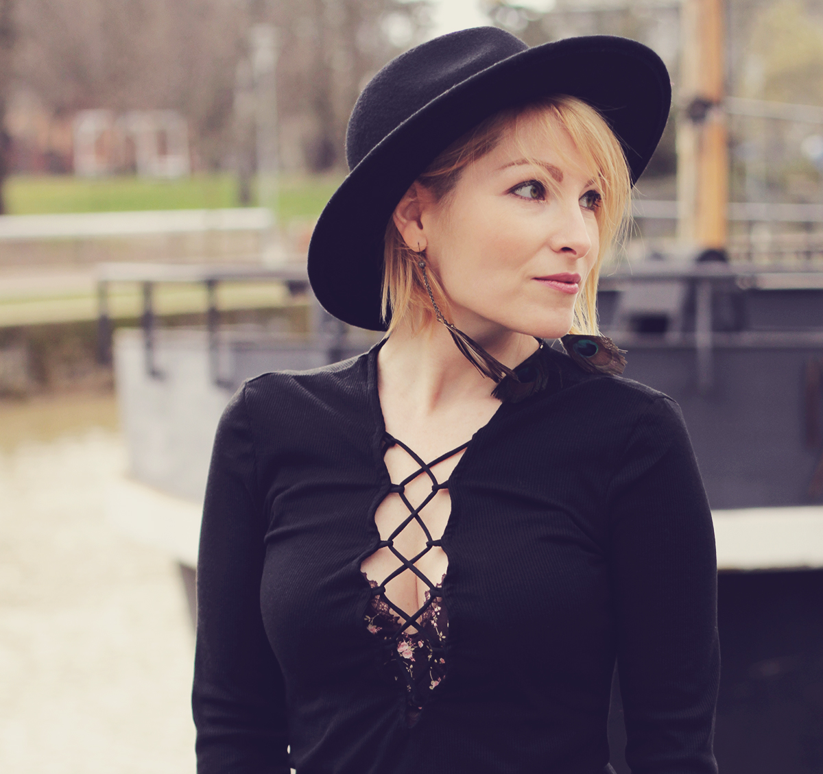 black lace-up top and wool hat