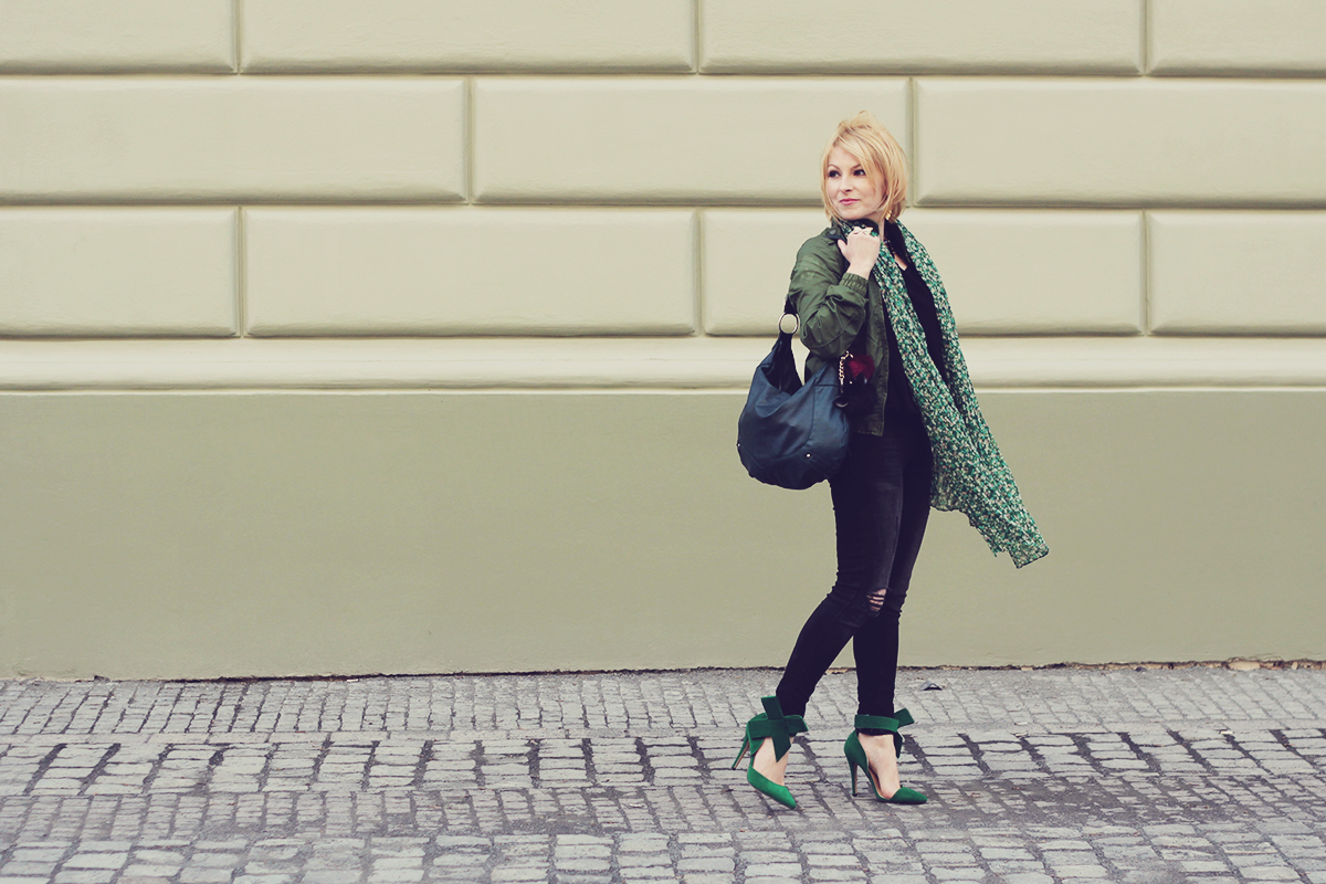 green bomber jacket and green scarf