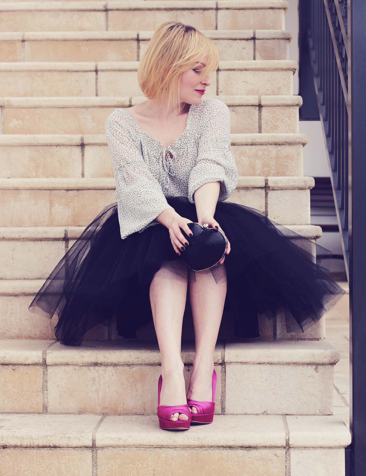 the tulle skirt and heart shaped clutch with pink pumps