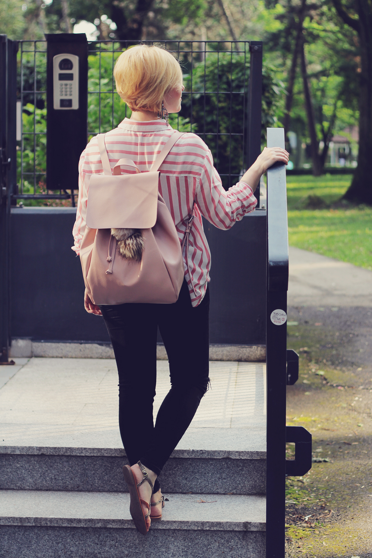 pink backpack and pink stripe shirt with sandals