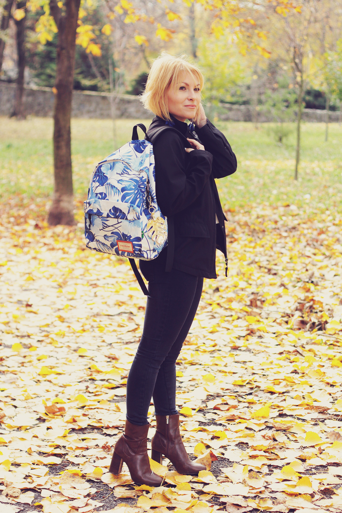 autumn, jeans, boots, tropical leaf print backpack, tassel earrings, navy jacket