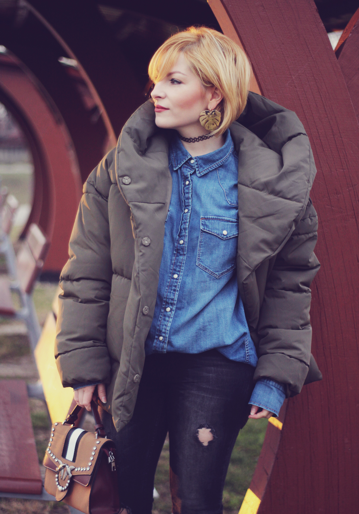 winter fashion, padded jacket, brown bag with bird detail, jeans, matte make-up, leaf earrings, choker
