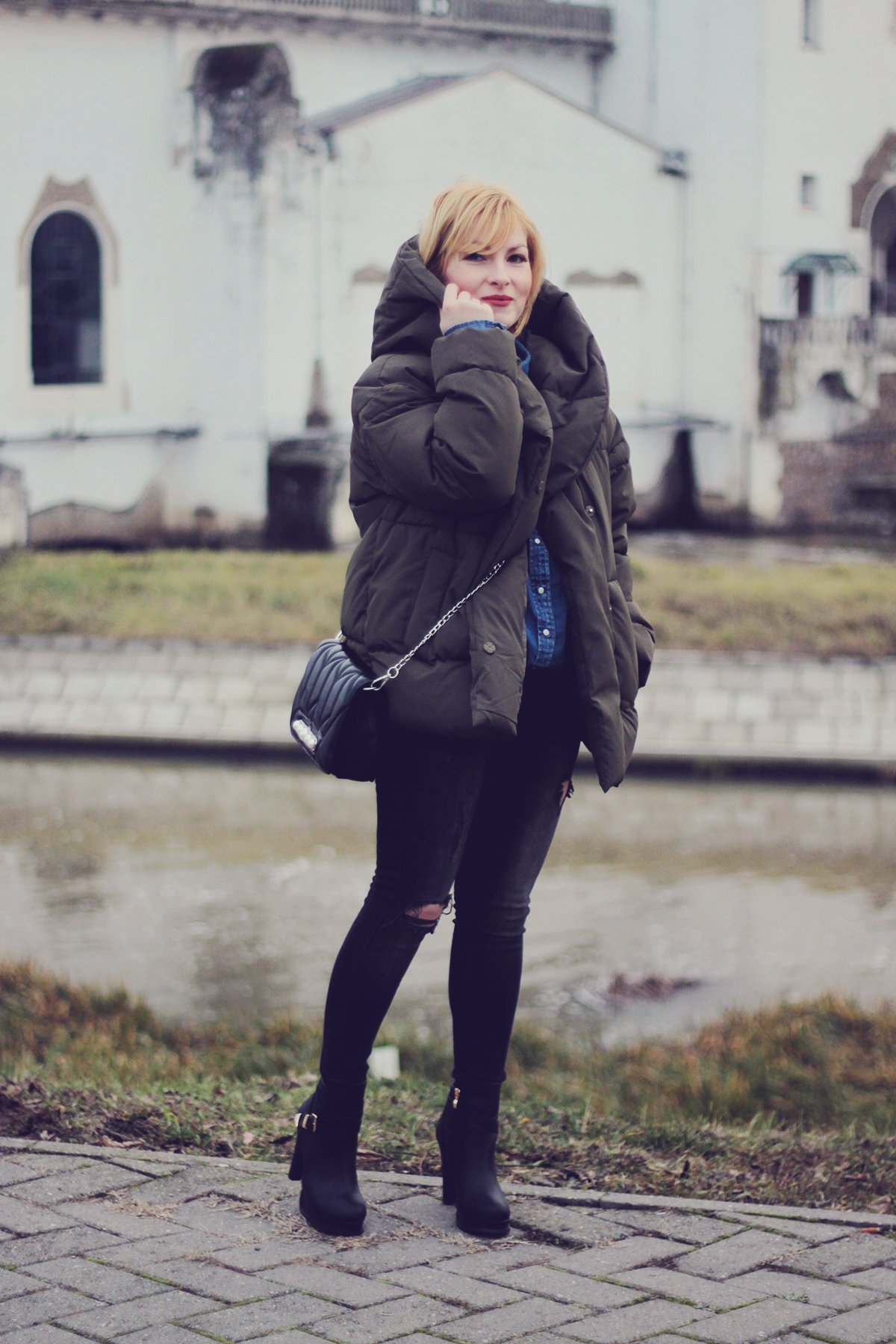 winter fashion, padded jacket, chevron bag with pearl detailing, jeans, high boots, matte make-up, leaf earrings, choker