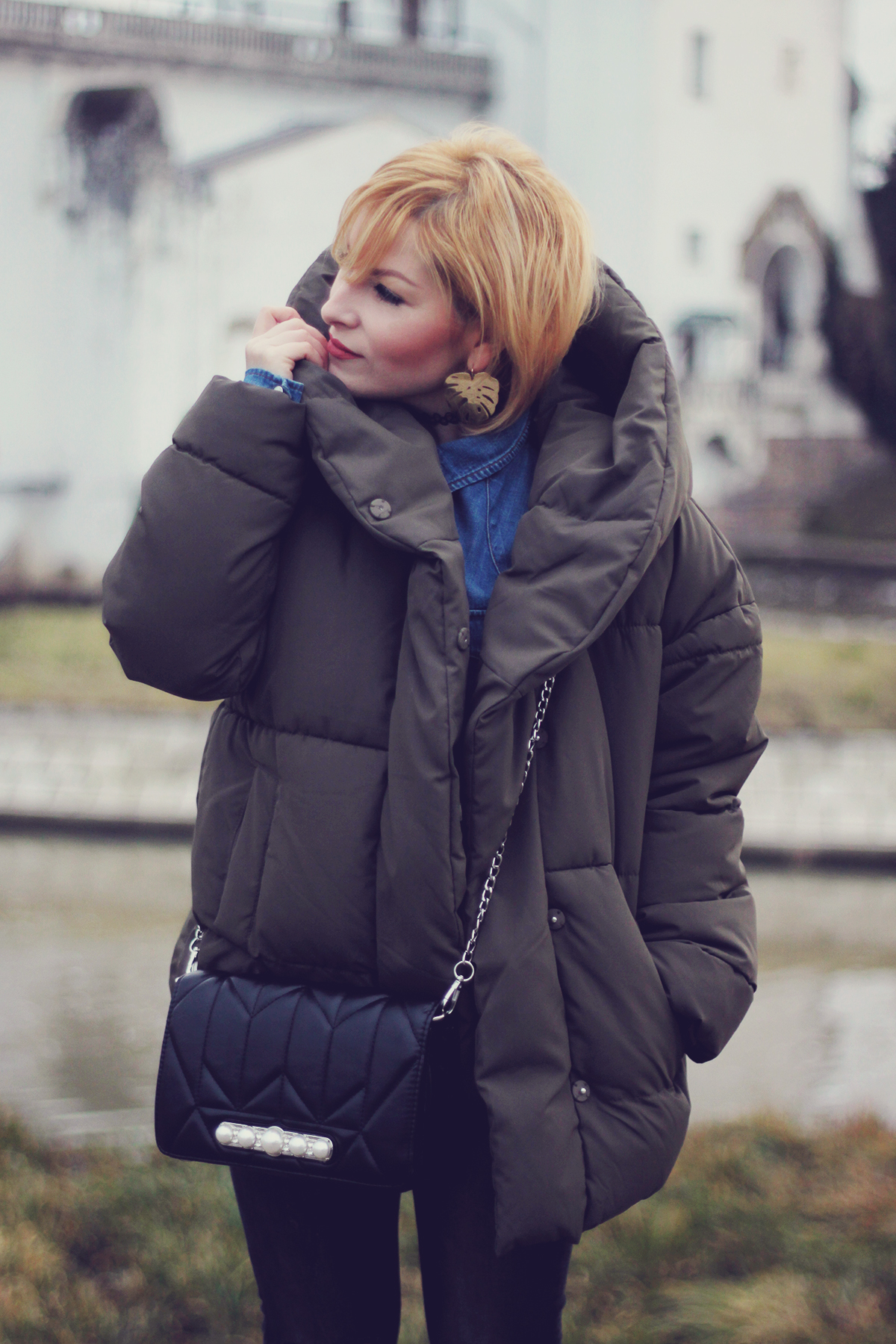 winter fashion, padded jacket, chevron bag with pearl detailing, jeans, matte make-up, leaf earrings, choker
