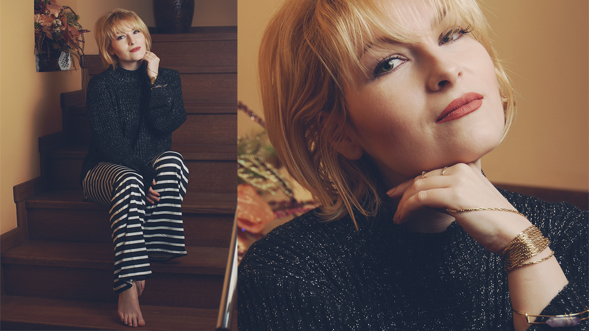 Dior vintage necklace worn as a bracelet, Rosegal stone bracelet, black sparkly sweater, black and white striped flare pants, matte lips, short blonde bob with bangs, lounging at home