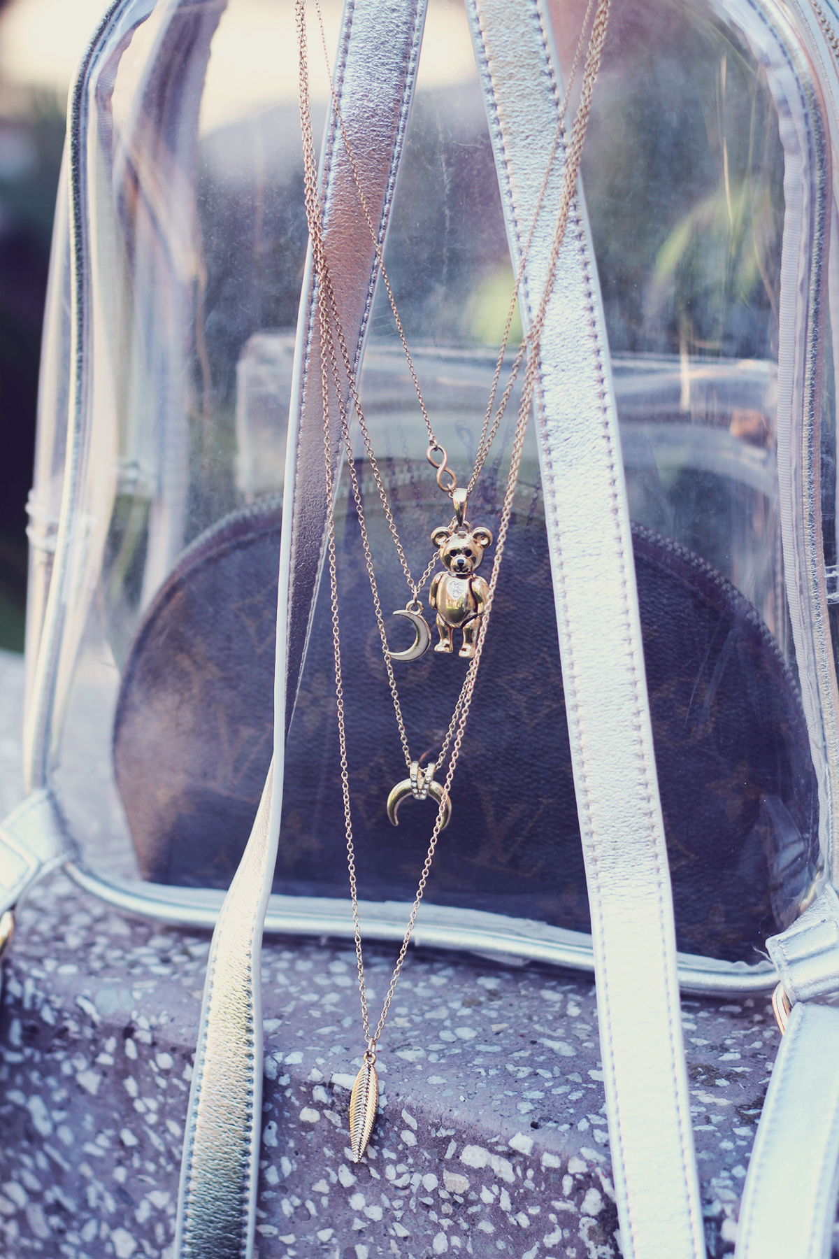 layered necklace, cute vintage bear pendant, louis vuitton make-up pouch, transparent backpack