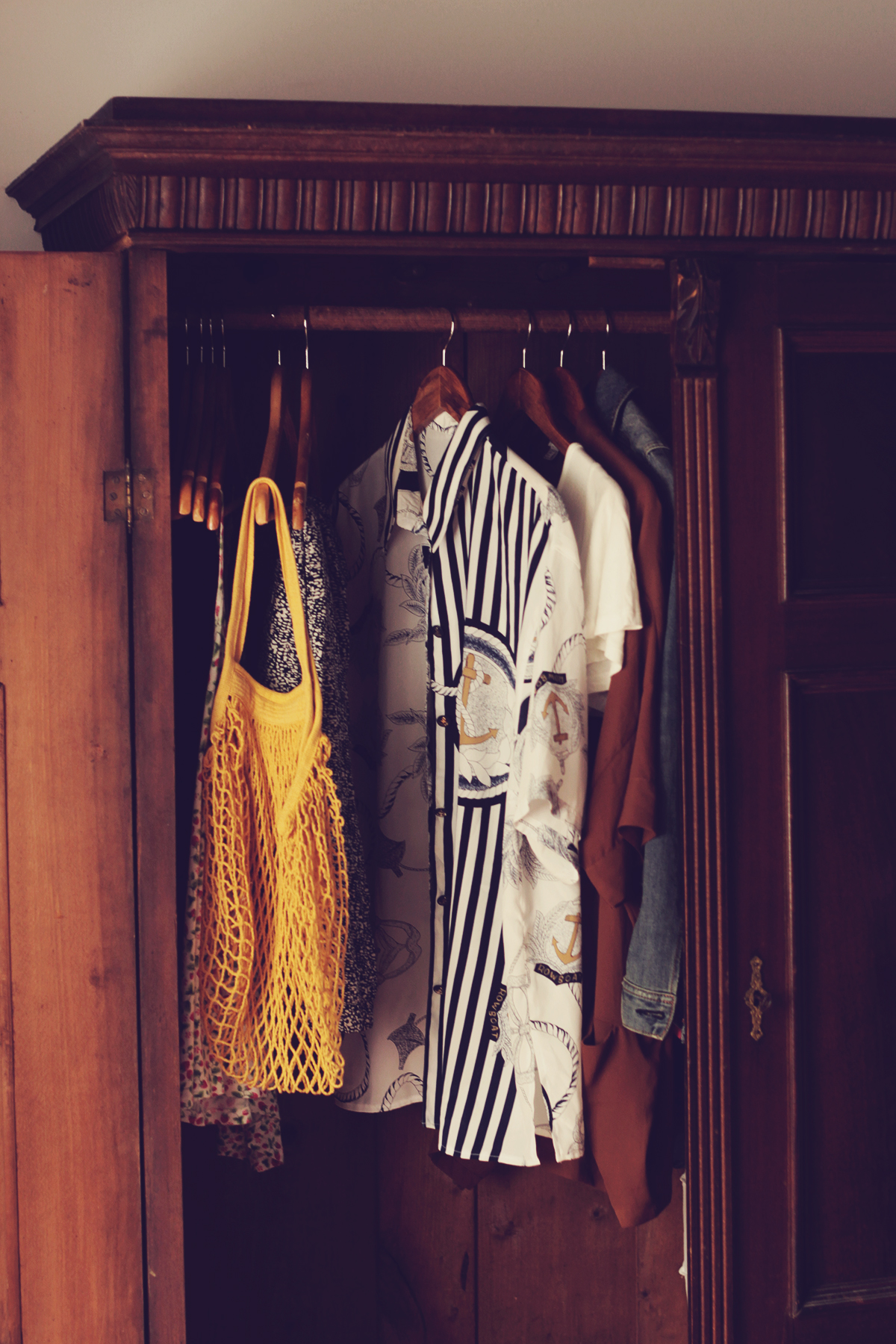 old mansion, wooden closet, vintage shirt, clothes in a wooden closet, net bag
