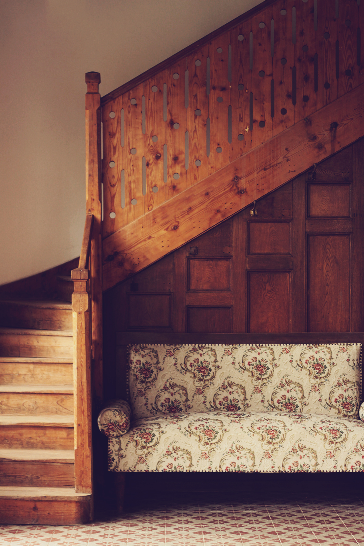 old staircase, old mansion, wooden staircase, floral vintage couch