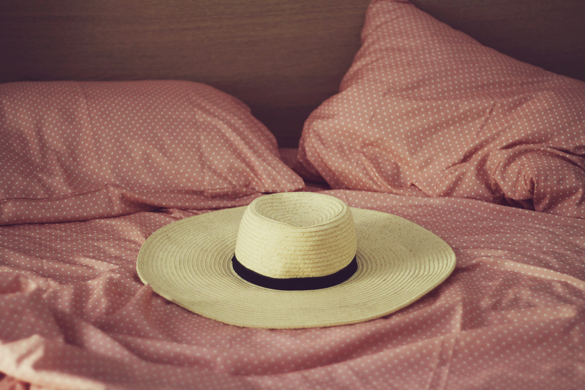 Corfu Town, travel post, travel style, straw hat on bed