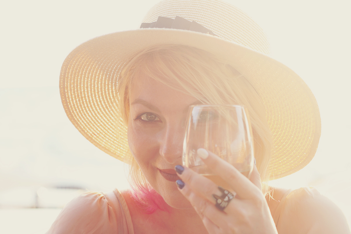 Thessaloniki, travel fashion, travel wear, Summer style, nude top, straw hat, living my best life, glass of wine, cat ring, travel post