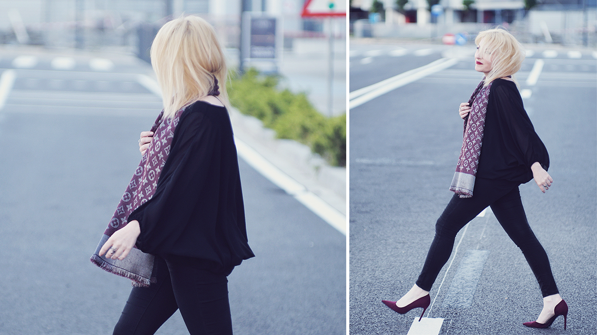 burgundy Louis Vuitton scarf, skinny black jeans, burgundy heels, black silk top, blonde hair, office look