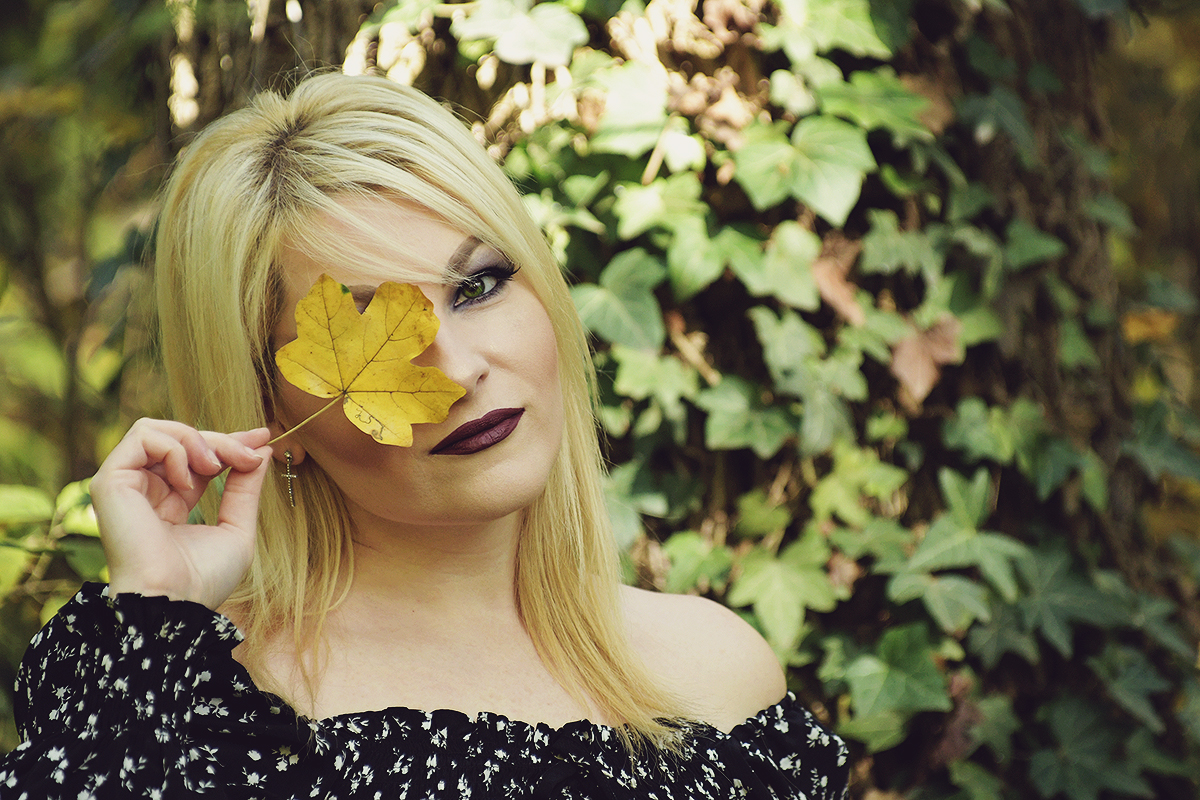 dark make-up, simple halloween look, fall fashion, fashionable goth, cross earring, autumn leaf, off shoulder crop top